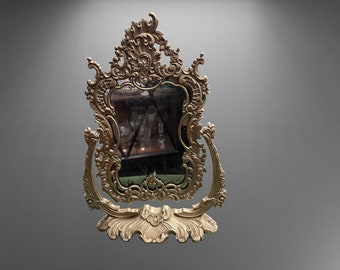 Antique mirror in a bronze frame with a rotating mechanism. Antique tabletop psyche mirror. 19th century mirror.