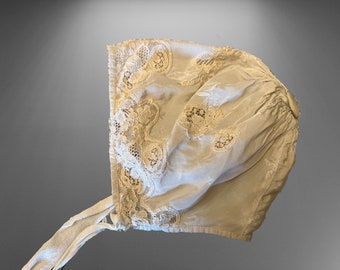 Antique French christening cap made of silk and lace, museum piece