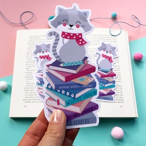 Bookmark with cute cat on stack of books