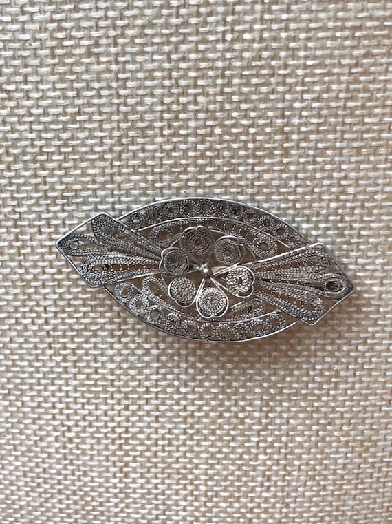 Antique cannetille silver brooch