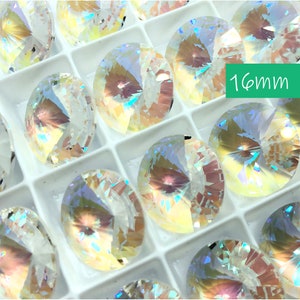 May include: A close-up view of a tray of iridescent, clear glass round gems. The gems are arranged in rows and are all 16mm in diameter. The text "16mm" is visible in the image.