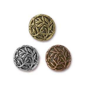 May include: Three round metal buttons with a leaf design. One button is gold, another is silver, and the third is bronze. The buttons are on a white background.