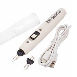 May include: A white Bead Smith ThreadZap tool with a black switch, two tips, and a clear plastic cover. A white USB cable and an additional black tip are also included. The tool is designed for crafting and jewelry making.