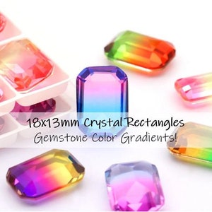 May include: Assortment of 18x13mm crystal rectangles with gemstone color gradients. The crystals are arranged on a white surface and feature a variety of colors, including pink, blue, green, and yellow.