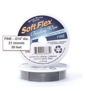 May include: Satin silver Soft Flex beading wire on a white spool. The fine wire is .014" in diameter, with 21 strands, and 30 feet in length. The spool is labeled "FINE" and is designed for seed beads and freshwater pearls.