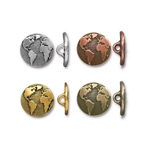 May include: Four metal buttons featuring a globe design. The buttons are available in silver, copper, gold, and antique brass.