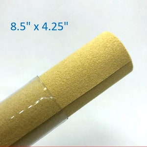 May include: A roll of 8.5" x 4.25" beige felt fabric.