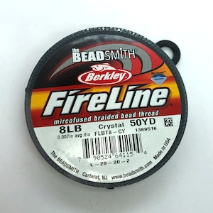 May include: A spool of Berkley FireLine microfused braided bead thread in crystal color. The spool is 50 yards and 8lb test. The label also includes the text "The Beadsmith Carteret, NJ www.beadsmith.com Made in USA".