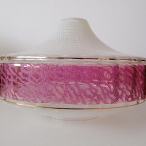 May include: A vintage glass lampshade with a white textured top and a pink patterned band. The shade has gold trim and a clear base, offering a retro aesthetic. The design is suitable for a ceiling light or pendant lamp.