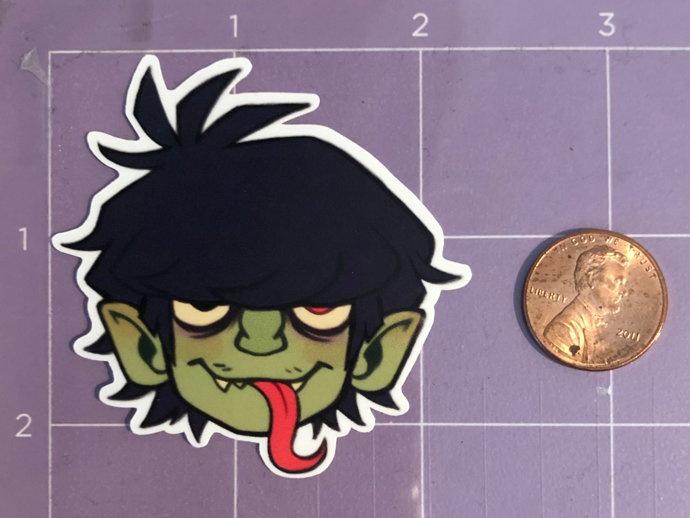 With a couple sheets of magnet paper and a lot of cutting, I finally found  a good way to display my Gorillaz stickers : r/gorillaz