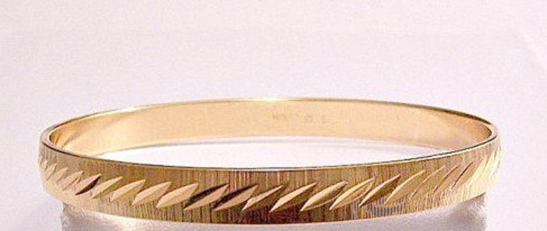 Vintage Monet Gold Tone Bangle