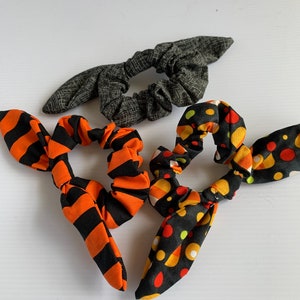 Trick or Treat Halloween Handmade Hair Bow Scrunchies (Pack of three). Halloween themed black and orange scrunchies