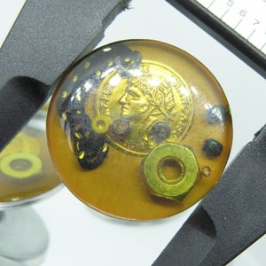Button Steampunk Treasure Resin on metal base - Amber in color Priced Per Piece 27.6mm