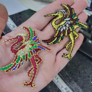 Toppa termoadesiva con cicogna metallizzata e occhio di gemma