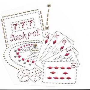 May include: A rhinestone iron-on design featuring a slot machine with the word "Jackpot" and three sevens, playing cards, and dice. The design is made of silver, gold, and red rhinestones.