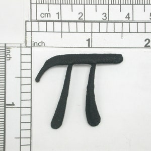May include: Black felt patch in the shape of the mathematical symbol pi, approximately 3.14.