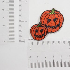 Pumpkin Head Jack O Lantern Pair  Embroidered on Orange Twill Backing  Measures 1 15/16&quot; high x 1 3/4&quot; wide