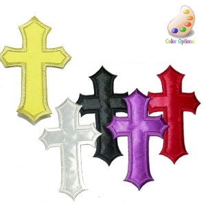 May include: Five embroidered iron-on patches in the shape of a cross. The crosses are in yellow, white, black, purple, and red.