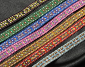 May include: Assortment of colorful patterned trim with geometric designs. The trim is made of woven fabric and has a variety of colors, including red, green, blue, gold, and silver.