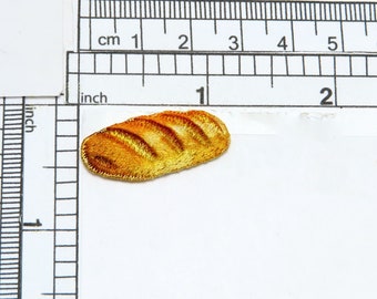 Aplikacja w kształcie bochenka chleba - francuska bagietka, w pełni haftowana aplikacja Wymiary 1-1/8" x 1/2" (28,5 mm x 12,7 mm)