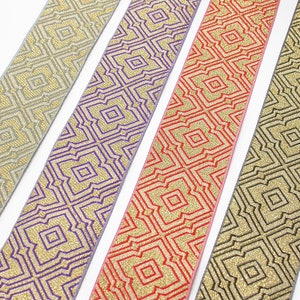 May include: Four different patterned ribbons with a gold glitter design. The ribbons are silver, purple, red, and black.