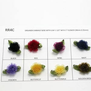May include: Assortment of ten 1 inch organza cabbage roses with leaves. Colors include black, red, wine, navy, hyacinth, buttercup, buttermilk, and golden brown. RR4C.