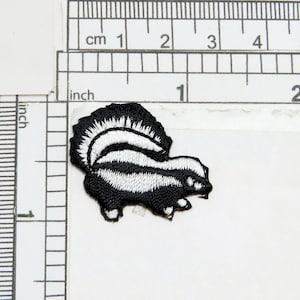 Skunk Embroidered Iron On Patch  Fully Embroidered  Measures 1 1/4&quot; across x 1&quot; high approx
