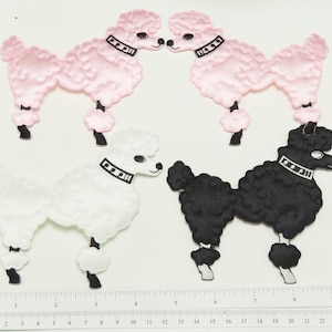 May include: Four felt poodle appliques in pink, white, and black. The appliques are in a variety of poses and are perfect for adding a touch of whimsy to any project.