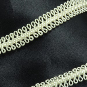 Borda trançada em loop 5/8" (16 mm) fantasia rayon branco antigo preço por jarda