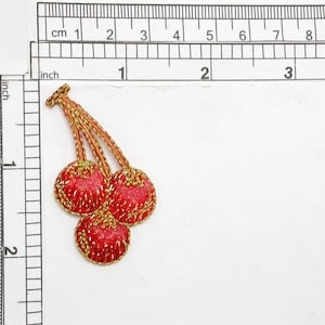 Cherry Shimmer Iron On Patch Applique Embroidered on a shimmering effect backing Measures 1 3/16&quot; across x 2 1/8&quot; high approximately