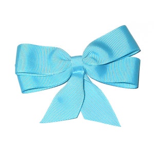 May include: A light blue satin bow with a striped pattern.