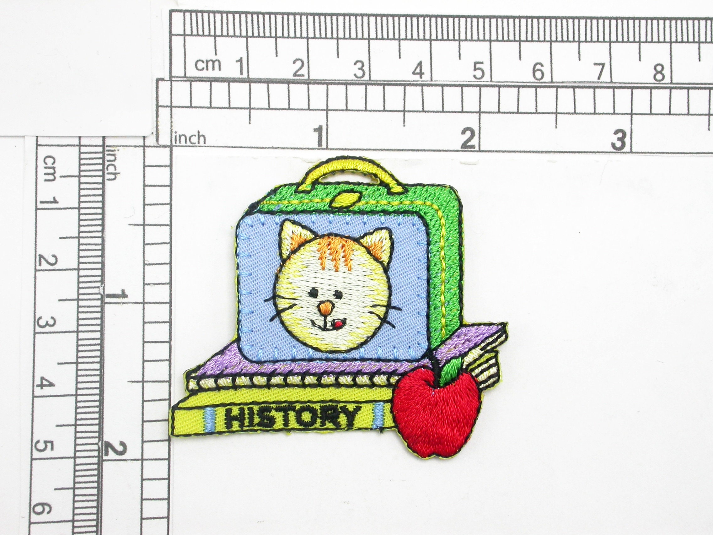 School Lunch Box & Books Iron On Patch Applique   Embroidered on Red Backing    Measures 2 high x 2 1/4" wide approximately