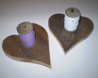 Wooden stand with binding thread coil
