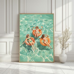 May include: Three women in swimsuits float on bright orange inflatable rings in a turquoise pool. The women are wearing sunglasses and smiling. The pool is filled with turquoise water and white foam.