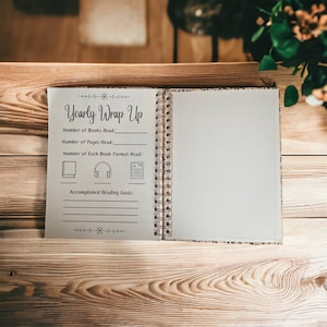 May include: A yearly reading wrap-up journal with a brown cover and gold spiral binding. The journal has sections for tracking the number of books read, pages read, and reading goals.