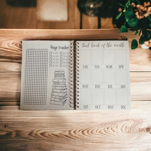 May include: A beige book with a page tracker and a "Best book of the month" section. The page tracker has a grid for marking pages read and a list of page ranges. The "Best book of the month" section has a grid for each month of the year.