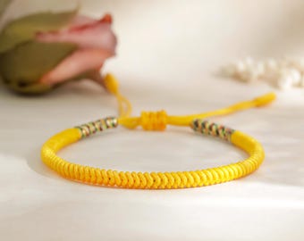 RADIANT SHIELD Orange Yellow Sliding Knot Buddhist Bracelet