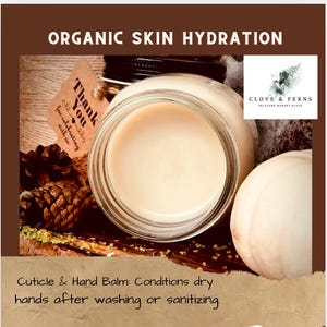 May include: A jar of cuticle and hand balm with the text "Organic Skin Hydration." The balm is light beige and sits in a clear glass jar. The image includes a pine cone, a tag that says "Thank You," and the logo for Clove & Ferns.
