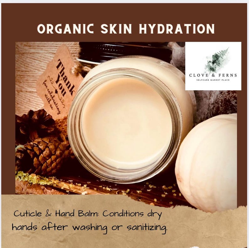 May include: A jar of cuticle and hand balm with the text "Organic Skin Hydration." The balm is light beige and sits in a clear glass jar. The image includes a pine cone, a tag that says "Thank You," and the logo for Clove & Ferns.