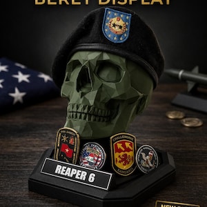 May include: A military beret display featuring a green skull wearing a black beret with a patch. The display includes a custom nameplate that reads "REAPER 6" and coin holders. The text "MILITARY BERET DISPLAY" is at the top.