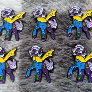 a bunch of pins with a cartoon character on them