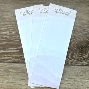 May include: Three white notepads with the text "Girlfriend Read Your Bible." printed on the top of each notepad.