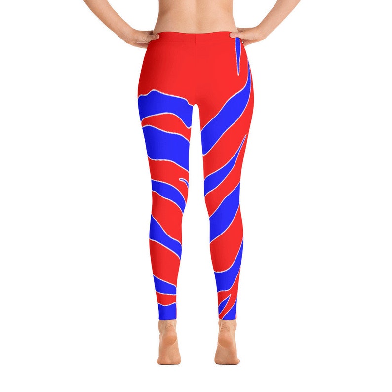 May include: Red leggings with a blue and white abstract pattern.
