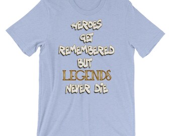 May include: Light blue t-shirt with a white graphic that reads "Heroes get remembered but Legends never die".