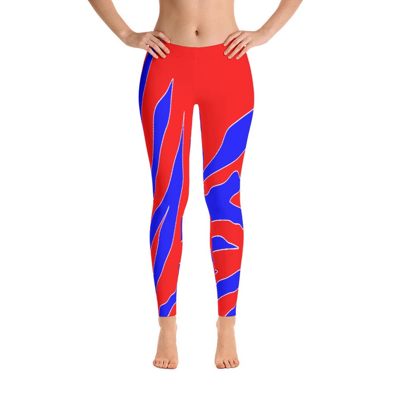 May include: Red leggings with a blue and white abstract pattern.