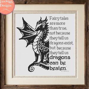 May include: A framed cross-stitch pattern featuring a black dragon silhouette on a white background, accompanied by the text: Fairy tales are more than true, not because they tell us dragons exist, but because they tell us dragons can be beaten.