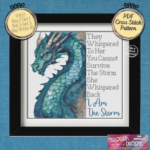 May include: A framed cross-stitch pattern featuring a teal dragon with the text "They Whispered To Her You Cannot Survive The Storm She Whispered Back I Am The Storm." Includes a sale promotion.