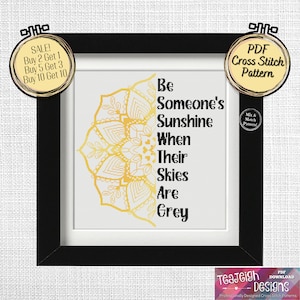 Puede incluir: Un patrón de punto de cruz de mandala dorado con el texto "Be Someone's Sunshine When Their Skies Are Grey".