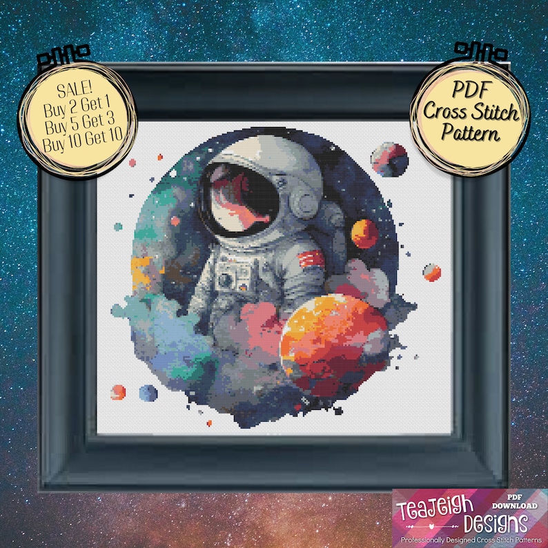 May include: A cross stitch pattern featuring an astronaut in a space suit with planets and stars in the background. The pattern is in a circular frame with a black background and a white border. The text "PDF Cross Stitch Pattern" is on a yellow circle in the top right corner of the image.