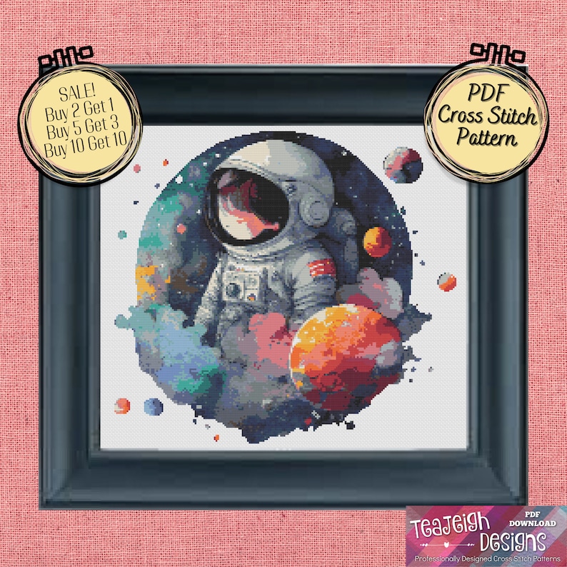 May include: A PDF cross stitch pattern featuring a watercolor-style illustration of an astronaut in a space suit standing in front of a planet with a colorful nebula background. The pattern includes the text "SALE! Buy 2 Get 1, Buy 5 Get 3, Buy 10 Get 10".
